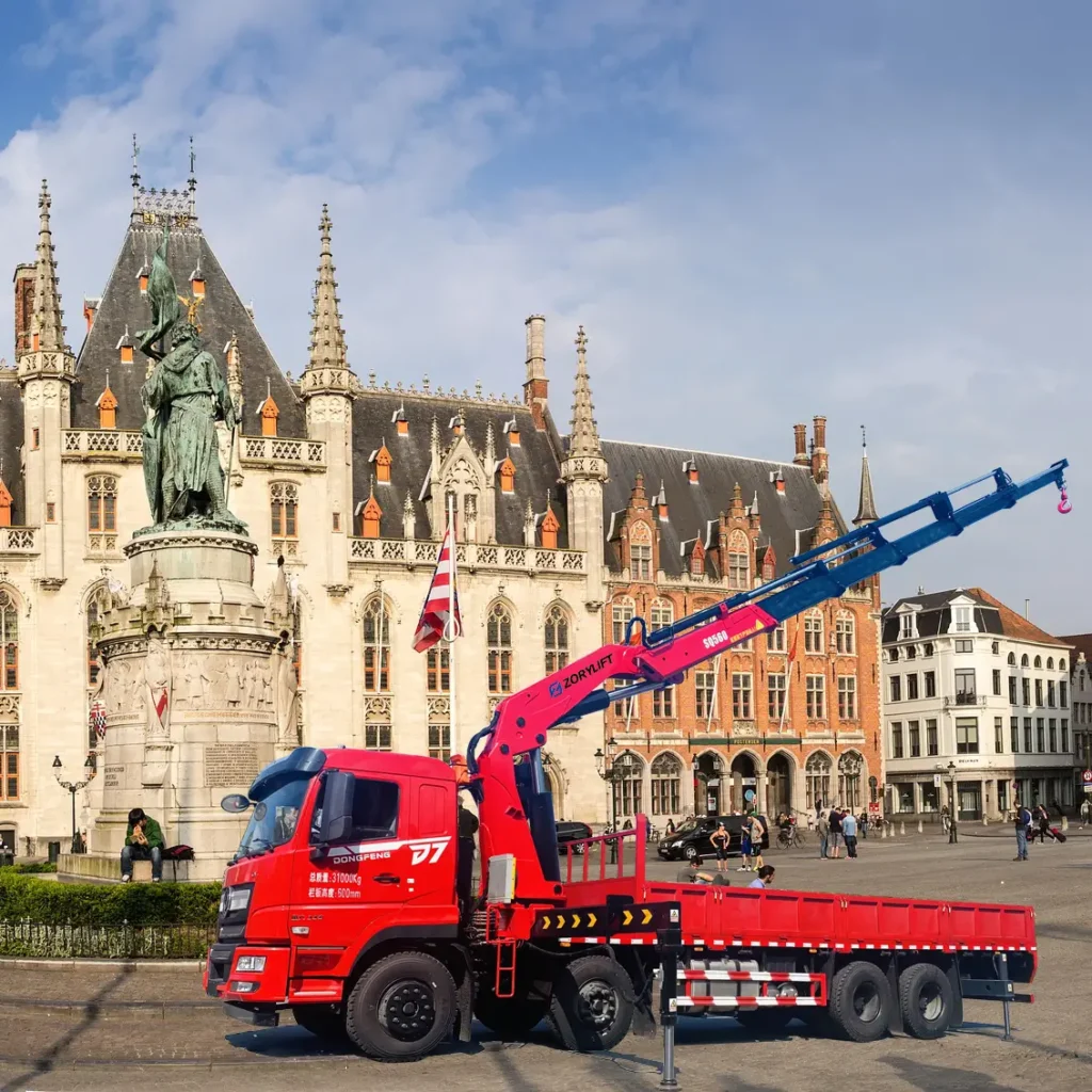 Customer's red Dongfeng lorry featuring a ZORYLIFT hydraulic folding boom crane (also known as a loader crane or truck mounted crane) in Europe.