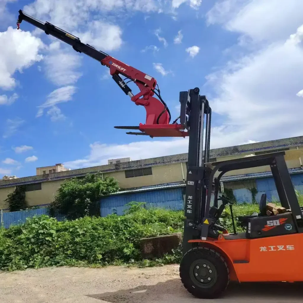 Customer's red ZORYLIFT forklift jib boom crane, a telescopic forklift crane attachment mounted on an orange Lonking forklift.