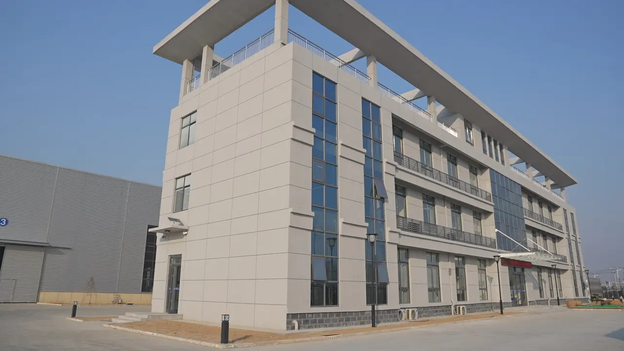 The bright office building of an engineering machinery manufacturer, showcasing the company's modern facilities, specializing in high-quality crane products.