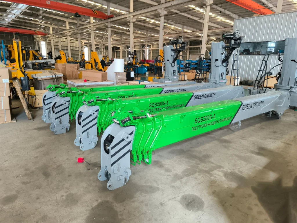 A batch of newly manufactured telescopic boom cranes, specifically the 8-ton SQS200G-5 model, ready for delivery. These truck mounted cranes are destined for Russia.